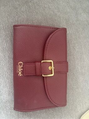 Chloé Burgundy Pebbled Leather Wallet with Gold Buckle Detail